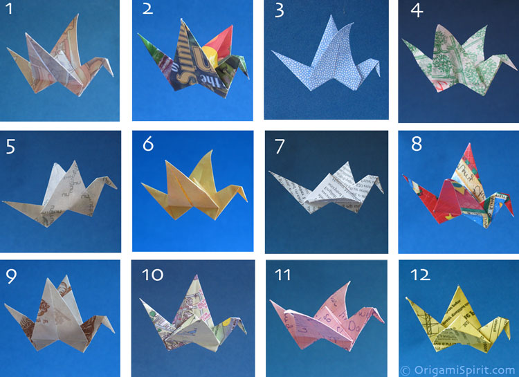 Examples of origami flapping birds folded from different recycled papers