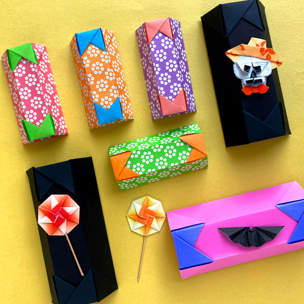 An origami model titled "Candy Coffin Box" designed by Alexandra Ramirez
