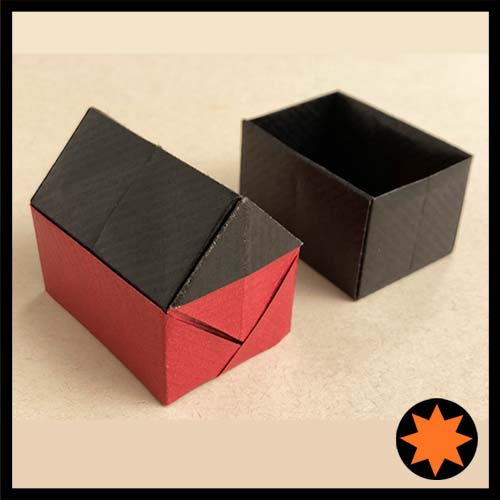 Origami Model of of a Gift House-Box designed by Roman Diaz (House) and Leyla Torres (Box)