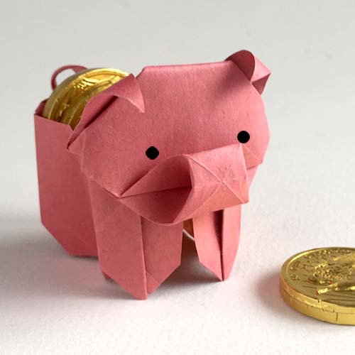 An Origami model titled "Pig Box" A design of Leyla Torres.